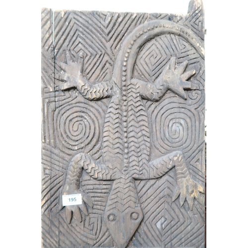 195 - A pair of west African granary doors extensively carved with reptile motifs, 159cm high x 67cm wide&... 