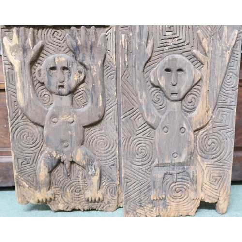 195 - A pair of west African granary doors extensively carved with reptile motifs, 159cm high x 67cm wide&... 