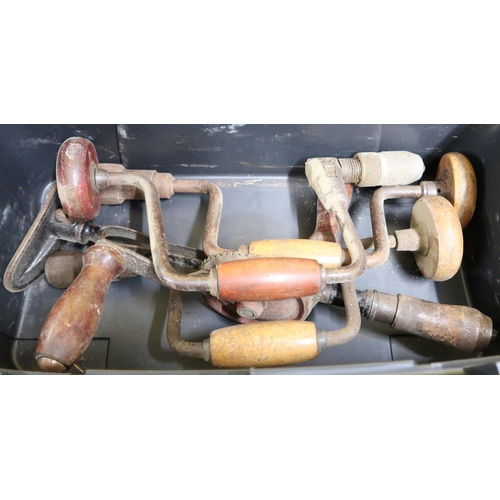 196 - A small tool box containing hand drills and a large wood plane