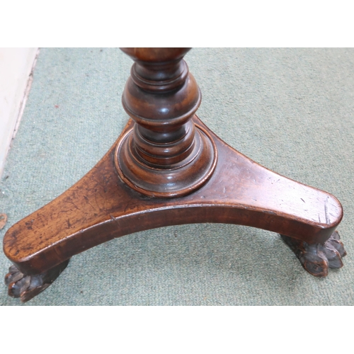 198 - A Victorian walnut circular topped games table trefoil base terminating in paw feet, 74cm high x 46c... 