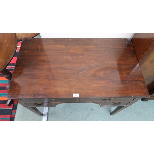 2 -  A 19th century mahogany writing desk with two long over two short drawers on square tapering s... 