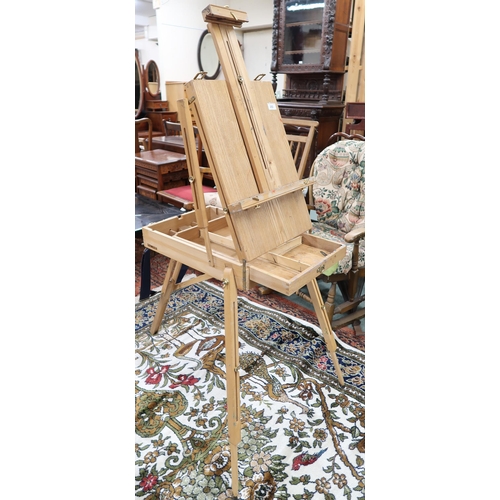 202 - A 20th century pine folding easel/paints case and another metal folding easels (2)