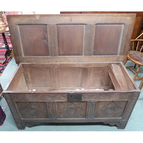 22 - An 18th century oak blanket chest with carved panel front, 71cm high x 151cm wide x 63cm deep