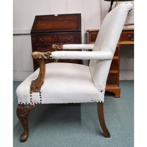 27 - An early 20th century open armchair with white vinyl upholstery on carved cabriole supports, 93cm hi... 