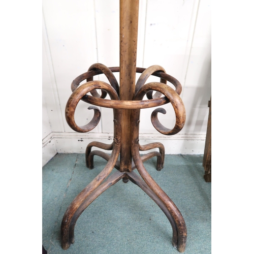 31 - A Victorian bentwood coat stand with scrolled quadrupedal base, 197cm high