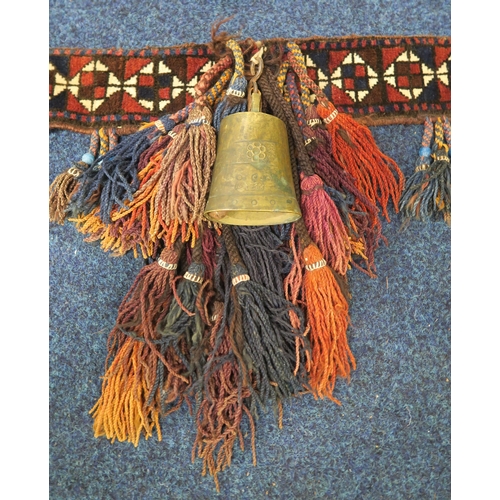 34A - A Balouch camel trapping/harness with suspended beaded tassels and bell cast with Arabic devices&nbs... 