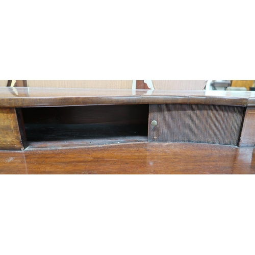 46 - A 19th century mahogany sideboard with tambour fronted superstructure over central drawer flanked by... 