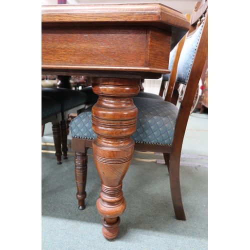 48 - A Victorian oak dining table on turned baluster supports 75cm high x  135cm long x 102cm deep a... 