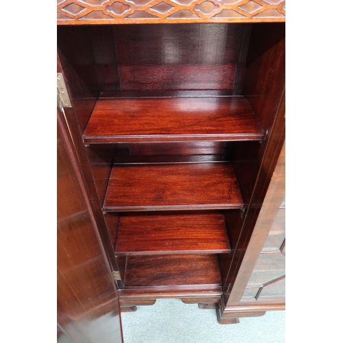 5 - A 20th century mahogany breakfront bookcase with pair of astragal glazed doors flanked by cabinet do... 