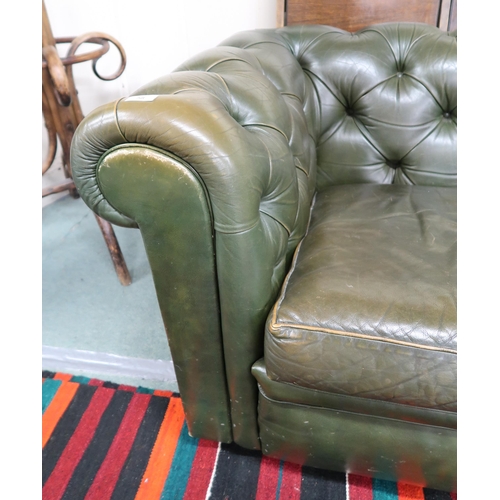 58 - A 20th century Chesterfield style green leather upholstered button back three seater club settee, 72... 