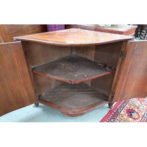 64 - A Victorian rosewood serpentine front corner cabinet with extensive inlaid top over pair of doors, 7... 