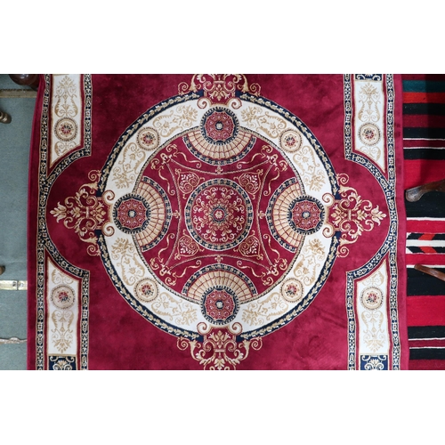 65 - A modern machine made Sarook-Kashan silk rug with cream and beige central medallion and borders on r... 