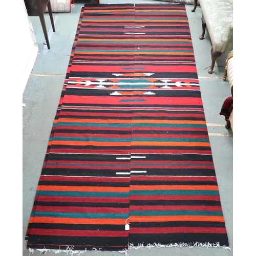 67 - An approximate pair of Zapotec Mexican rugs with geometric central medallion on multicoloured stripe... 