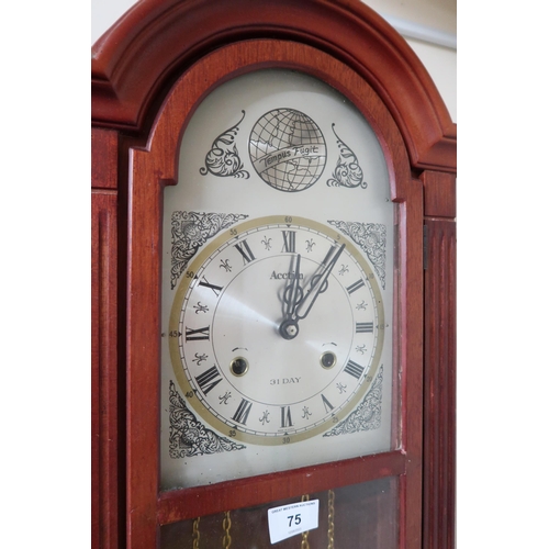 75 - A 20th century mahogany cased Tempus Fugit wall clock and an oval Victorian wall mirror (2)