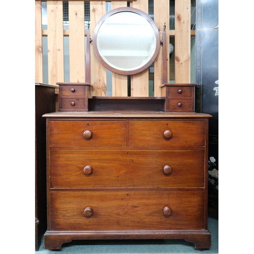 88 - A 20th century mahogany dressing chest with circular dressing mirror on four drawered superstructure... 