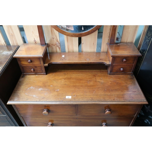 88 - A 20th century mahogany dressing chest with circular dressing mirror on four drawered superstructure... 