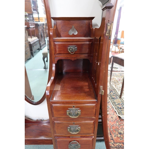 90 - An early 20th century mahogany arts and crafts dressing table with central oval dressing mirror flan... 