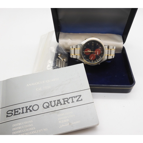 868 - A Seiko Chronograph, with three red dials on a metallic blue dial, stainless steel case and strap wi... 