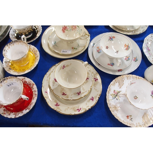 307 - A quantity of trios, mainly Austrian porcelain makes, together with a Royal Albert Harlequin set of ... 