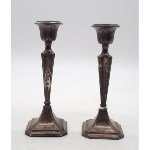 364 - A pair of George V silver candlesticks, by Clark & Sewell, Birmingham 1917, of faceted form, wit... 