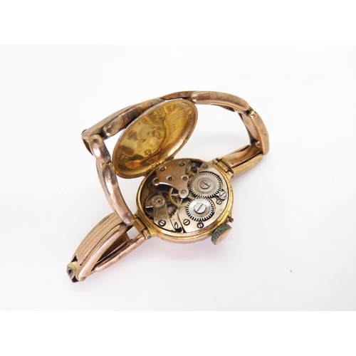 776 - A 9ct gold ladies watch and strap both stamped 9ct, weight including mechanism 19.8gms, together wit... 