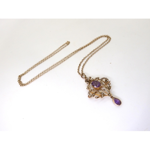 779 - A 9ct gold Edwardian amethyst and pearl pendant brooch on a long 66cm 9ct gold belcher chain, weight... 