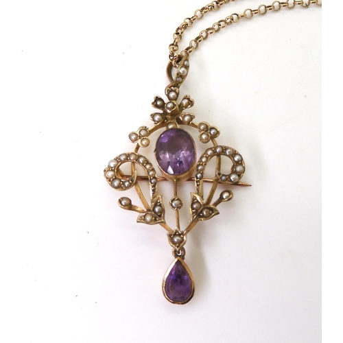 779 - A 9ct gold Edwardian amethyst and pearl pendant brooch on a long 66cm 9ct gold belcher chain, weight... 