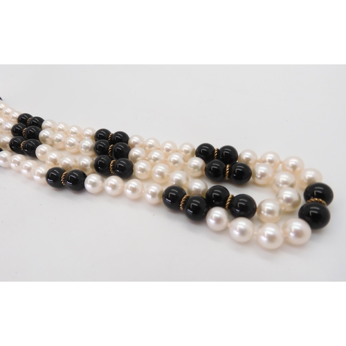 785 - An opera length of good quality pearls, onyx and gold beads, length 88cm