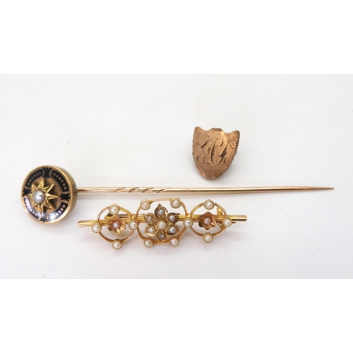 795 - A 15ct gold pearl set brooch length 3.9cm, weight 2.6gms, together with an enamel and pearl mourning... 