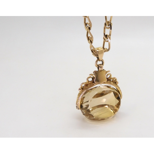 797 - A 9ct citrine fob seal hallmarked Birmingham 1915, on a long 9ct gold fancy chain, length 60cm, weig... 