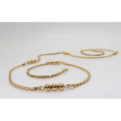 801 - A 9ct gold fancy chain with a beaded detail, length 67cm, weight 17.2gms