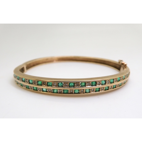 807 - A 9ct gold emerald and diamond bangle, together with a similar cz and emerald ring size N, weight to... 