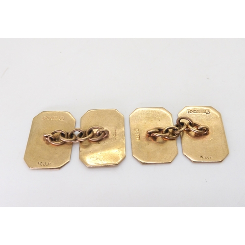 811 - A pair of 9ct gold cufflinks with Chester hallmarks for 1943, a 9ct gold garnet and pearl set lily o... 