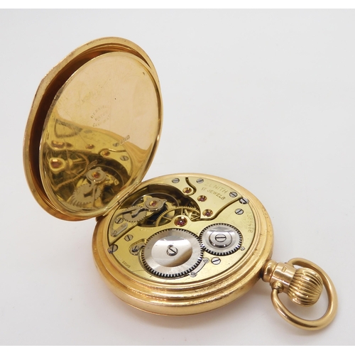 828 - An 18ct gold full hunter pocket watch, diameter 5cm, the inner dust cover inscribed with the date 19... 