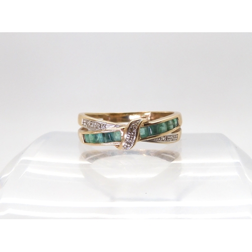 836 - A 9ct gold emerald and diamond crossover ring, size T, weight 2.5gms