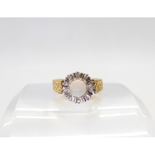 843 - An 18ct gold retro opal and diamond accent cluster ring, hallmarked Birmingham 1972, size M, weight ... 