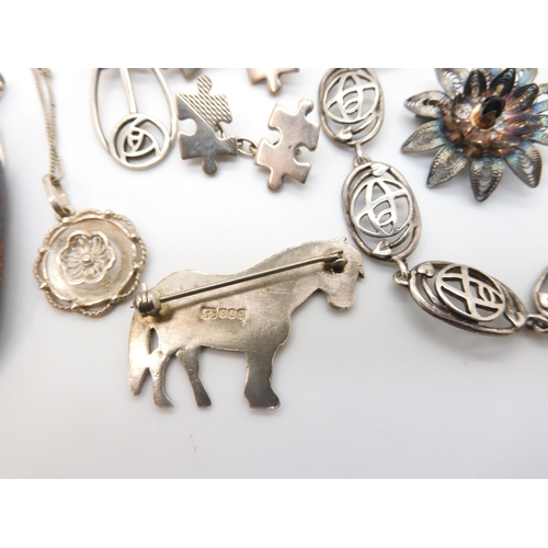 867 - A silver Shetland Silver Pony brooch, a boulder opal pendant, a pair of jigsaw puzzle cufflinks and ... 