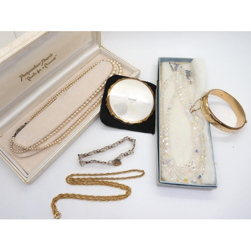 871 - A jewellery box containing, a silver gate bracelet with heart shaped clasp, a 1/5th 9ct gold with me... 