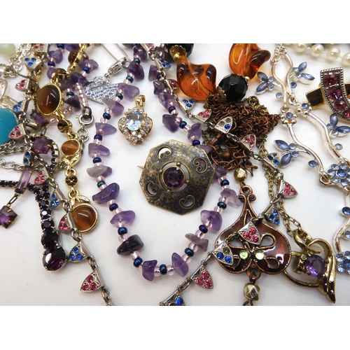 872 - A collection of vintage costume jewellery to include gem set necklaces, swallow brooches, an Arts &a... 