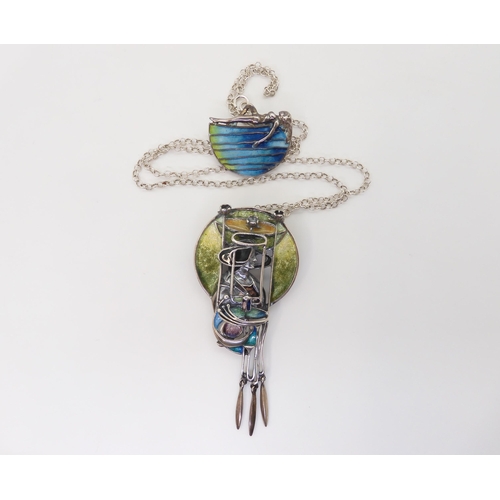 880 - A silver and enamel pendant in the style of Margaret MacDonald, designed By Pat Cheney for The Glasg... 