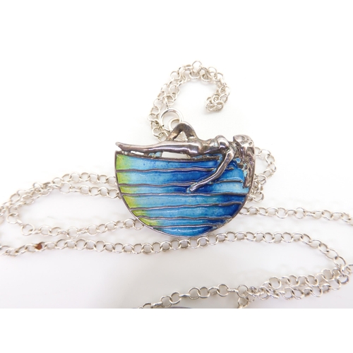 880 - A silver and enamel pendant in the style of Margaret MacDonald, designed By Pat Cheney for The Glasg... 