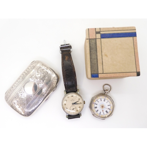 883 - A silver cigarette case, a continental silver fob watch with an enamelled decorative dial, together ... 