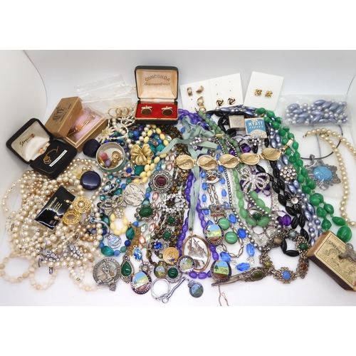 891 - A collection of vintage costume jewellery to include, items by Miracle, farming badges, beads, brooc... 