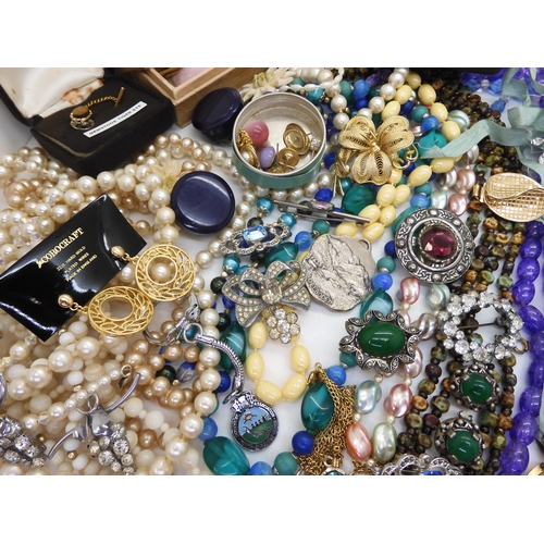 891 - A collection of vintage costume jewellery to include, items by Miracle, farming badges, beads, brooc... 