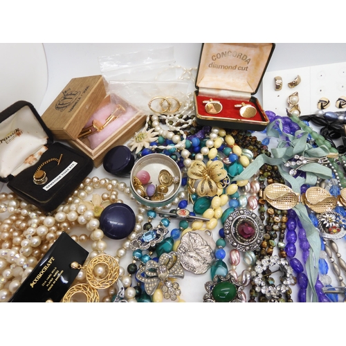 891 - A collection of vintage costume jewellery to include, items by Miracle, farming badges, beads, brooc... 