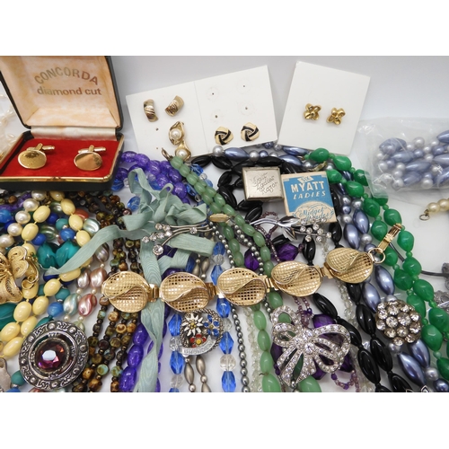 891 - A collection of vintage costume jewellery to include, items by Miracle, farming badges, beads, brooc... 