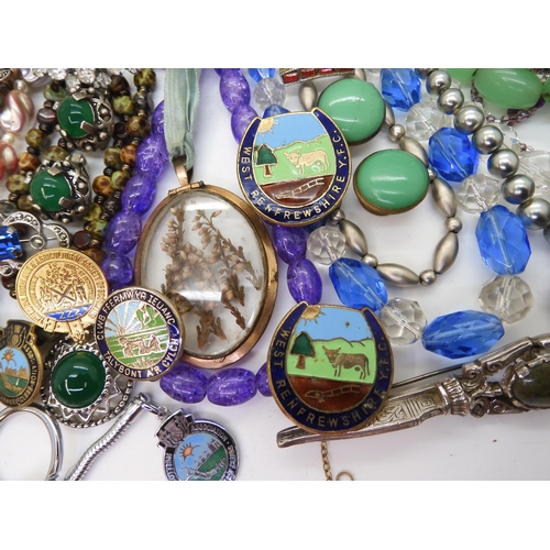 891 - A collection of vintage costume jewellery to include, items by Miracle, farming badges, beads, brooc... 