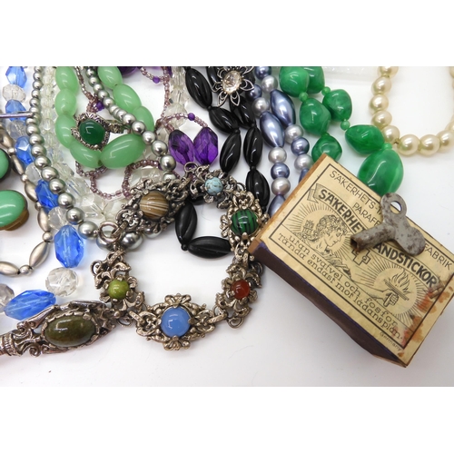 891 - A collection of vintage costume jewellery to include, items by Miracle, farming badges, beads, brooc... 