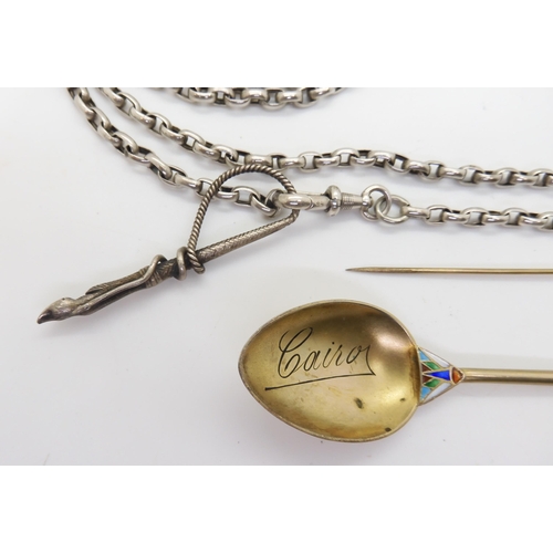 900 - A white metal long guard chain, with attached whip pendant with hoof terminal, a silver gilt spoon w... 