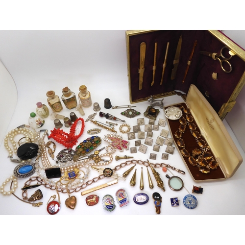 902 - Vintage perfume bottles, a gold plated manicure set, and a quantity of costume jewellery to include ... 